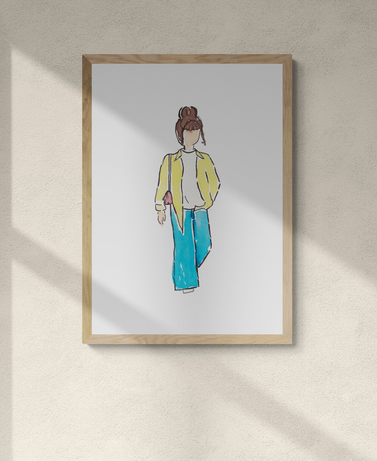 Framed illustration of a person wearing a yellow jacket and blue pants on a beige wall.Pinterest outfit inspo